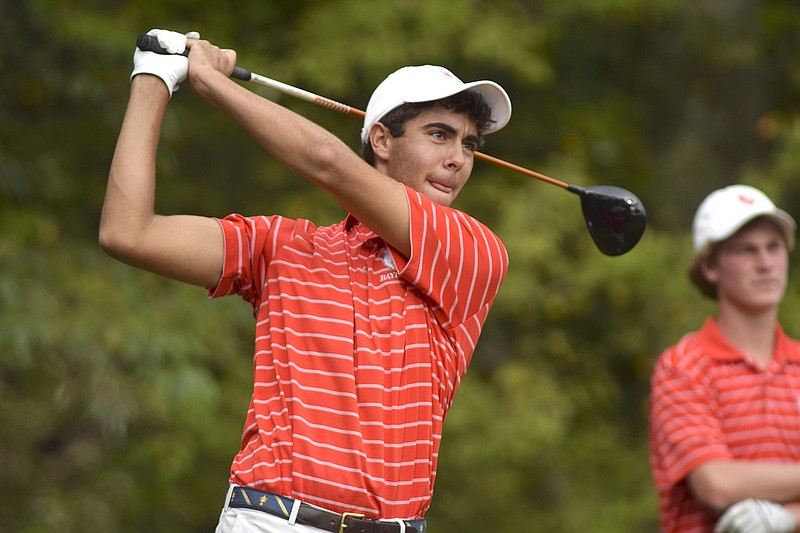 Baylor's Oliver Simonsen watches the flight of his tee shot, while teamate Chase Roswall looks on in the background.  Baylor faced McCallie in match play golf at the Lookout Mountain Golf Club on Thursday, September 24, 2015.