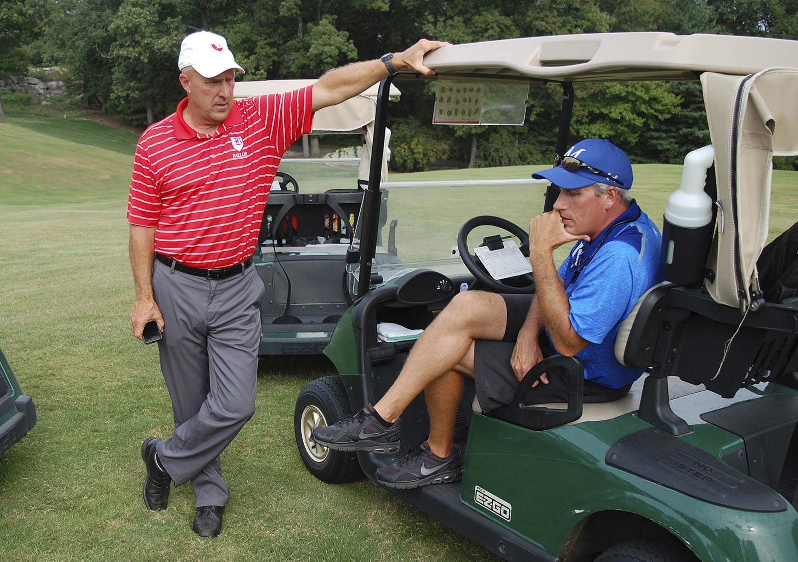 Baylor golf coach Gary Partrick (left) discusses the match with McCallie coach Rob Riddle.  Baylor faced McCallie in match play golf at the Lookout Mountain Golf Club on Thursday, September 24, 2015.