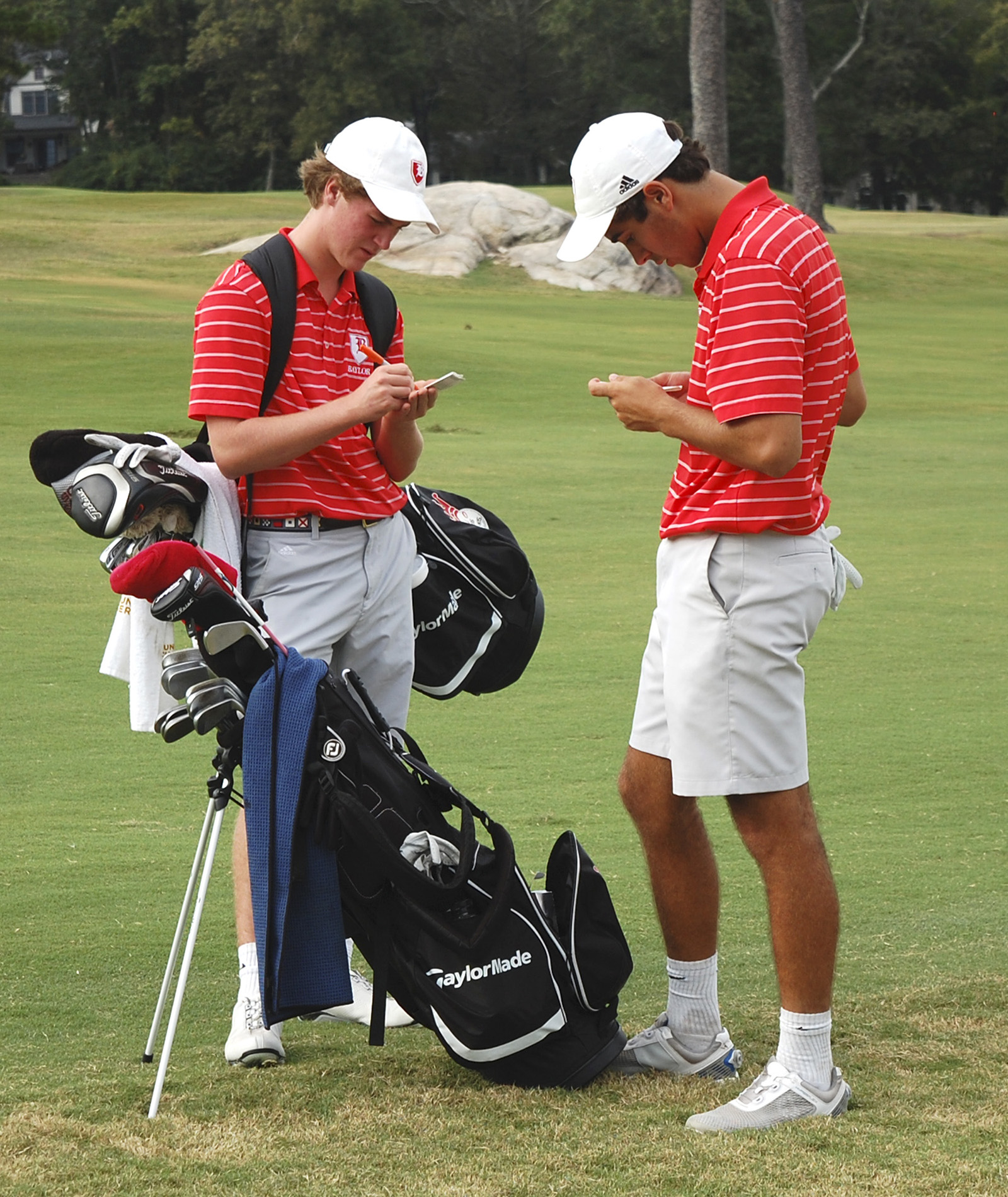 Baylor golfers Chase Roswall (left) and teammate Oliver Simonsen record their scores.  Baylor faced McCallie in match play golf at the Lookout Mountain Golf Club on Thursday, September 24, 2015.