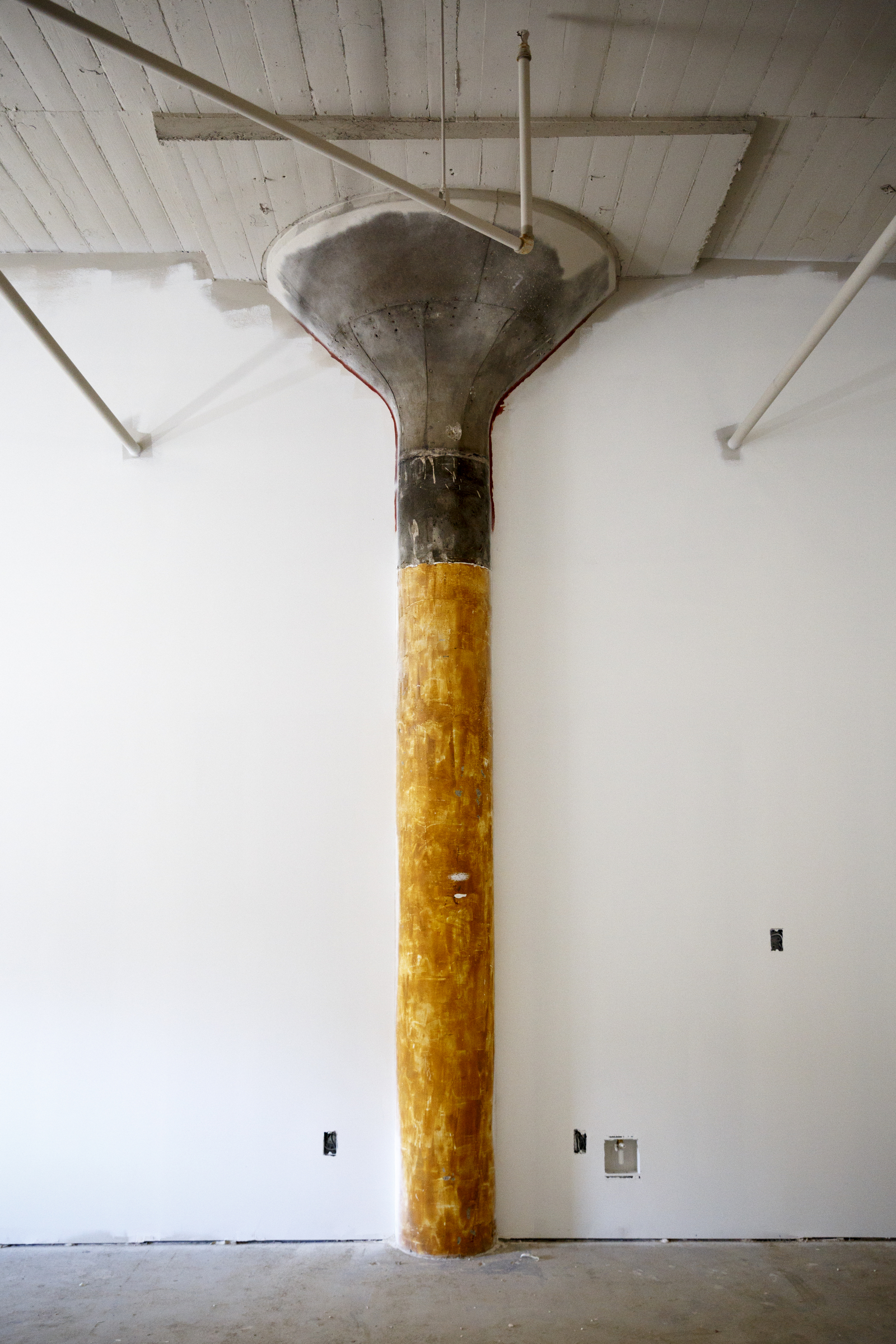 A support column, which will remain uncovered for decoration, is seen in a 2-bedroom loft under construction at the Clemons building Wednesday, Sept. 23, 2015, in Chattanooga, Tenn. The building, which dates back to the early 1920s, is being restored to offer luxury downtown loft apartments by owner and developer Vic Desai.
