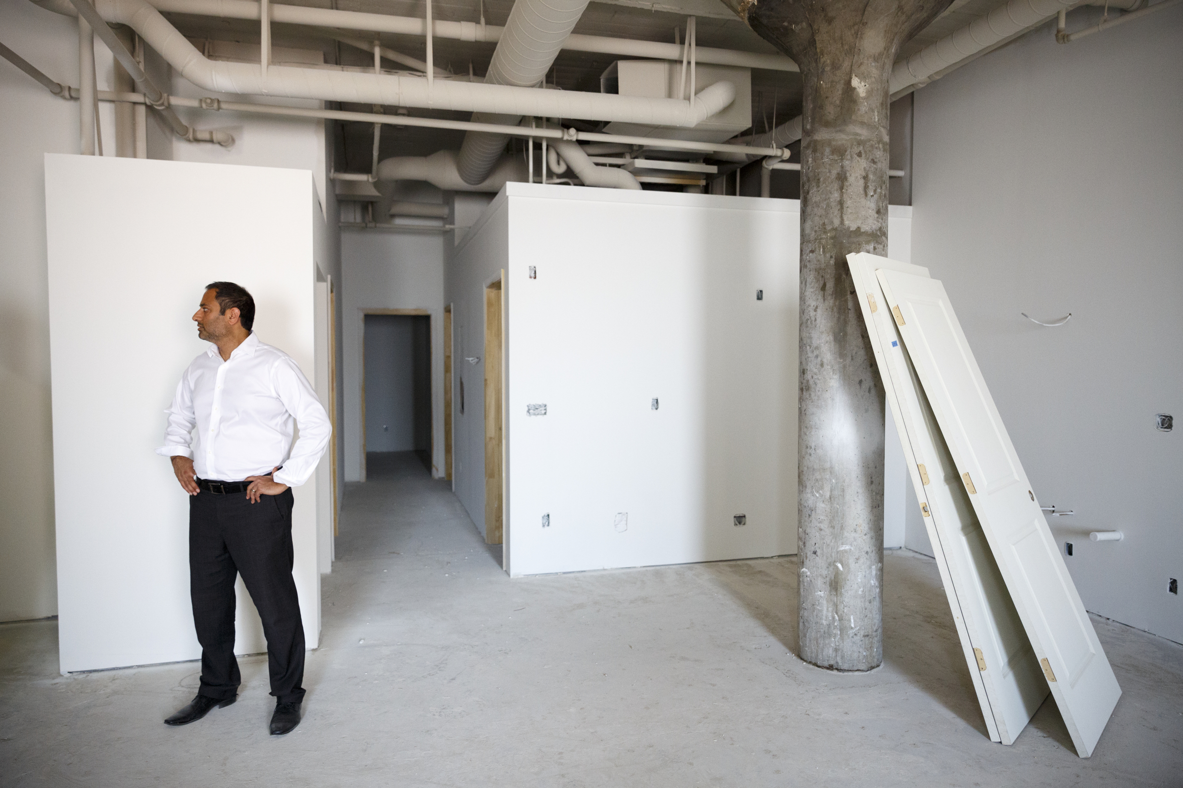 Developer and owner Vic Desai stands in a 3-bedroom loft under development at the Clemons building Wednesday, Sept. 23, 2015, in Chattanooga, Tenn. The building, which dates back to the early 1920s, is being restored by Desai to offer luxury downtown loft apartments.