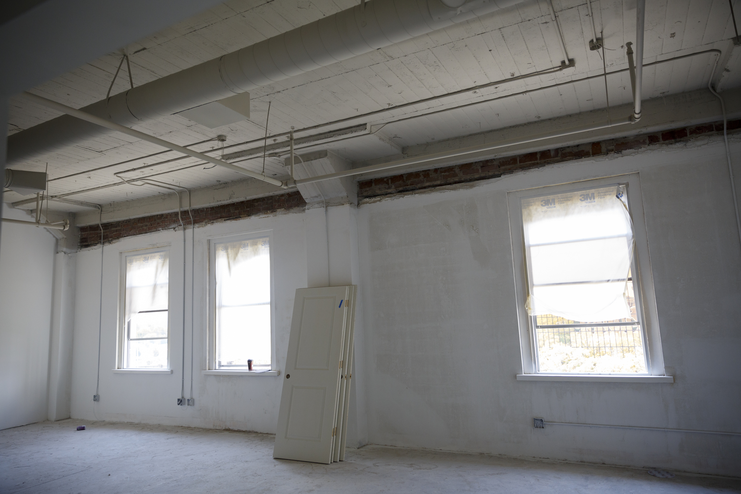 A 2-bedroom loft apartment with 3 windows is under construction at the Clemons building Wednesday, Sept. 23, 2015, in Chattanooga, Tenn. The building, which dates back to the early 1920s, is being restored to offer luxury downtown loft apartments by owner and developer Vic Desai.