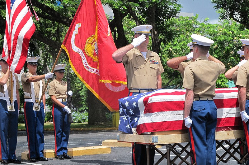 
              United States Marines salute during a Thursday, Sept. 24, 2015, ceremony in Honolulu for the departure of 1st Lt. Alexander Bonnyman's remains. The recently identified remains of Bonnyman who was hailed for his bravery in battle are heading home 72 years after he was killed on a remote Pacific atoll during World War II. (AP Photo/Audrey McAvoy)
            