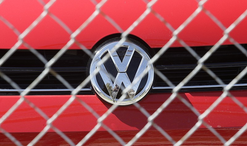 
              A Volkswagen diesel sits behind a security fence on a storage lot near a VW dealership Wednesday, Sept. 23, 2015, in Salt Lake City. Volkswagen CEO Martin Winterkorn resigned Wednesday, days after admitting that the world's top-selling carmaker had rigged diesel emissions to pass U.S. tests during his tenure. (AP Photo/Rick Bowmer)
            