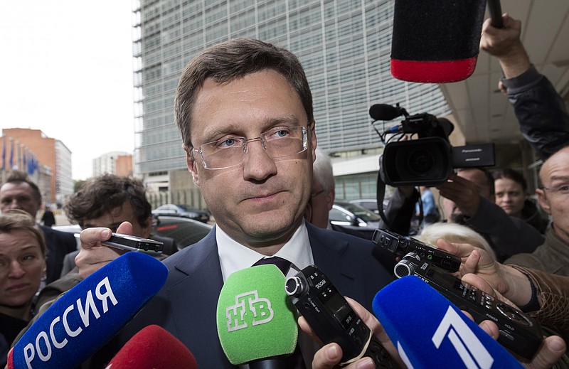 
              Russia's Energy Minister Alexander Novak, center, speaks with the media as he arrives in front of EU headquarters in Brussels on Friday, Sept. 25, 2015. Russia and Ukraine resumed talks on Friday in Brussels, aimed at trying to clinch a deal guaranteeing that Ukraine will receive shipments of Russian natural gas this winter. (AP Photo/Thierry Monasse)
            