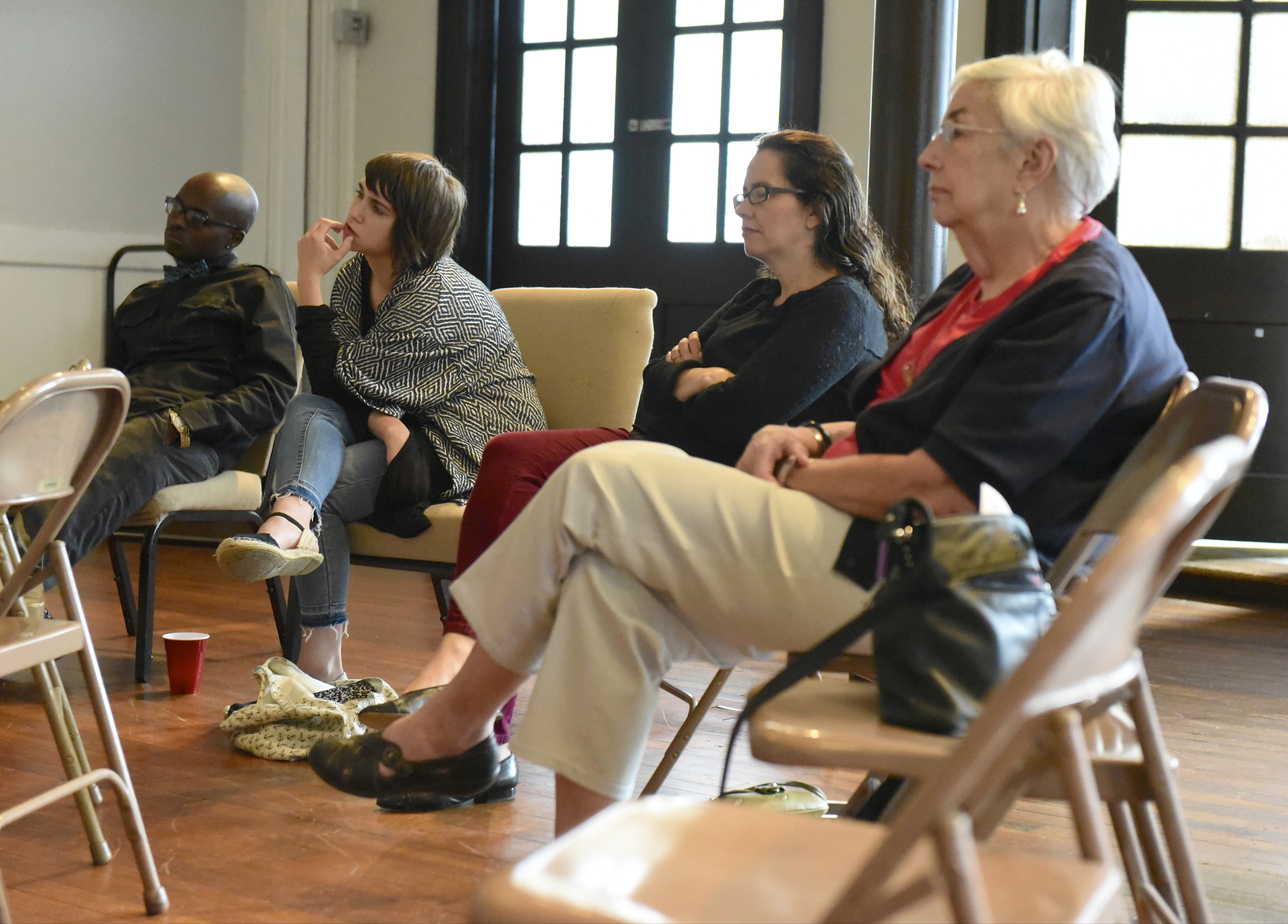 Terry Davis, Megan Hollenbeck, Carol Howard Merritt and Dan Stubsten, from left, listen during a worship service at the Mercy Junction Justice and Peace Center at St. Andrews in the Highland Park community on Sunday, Sept. 13, 2015, in Chattanooga, Tenn.