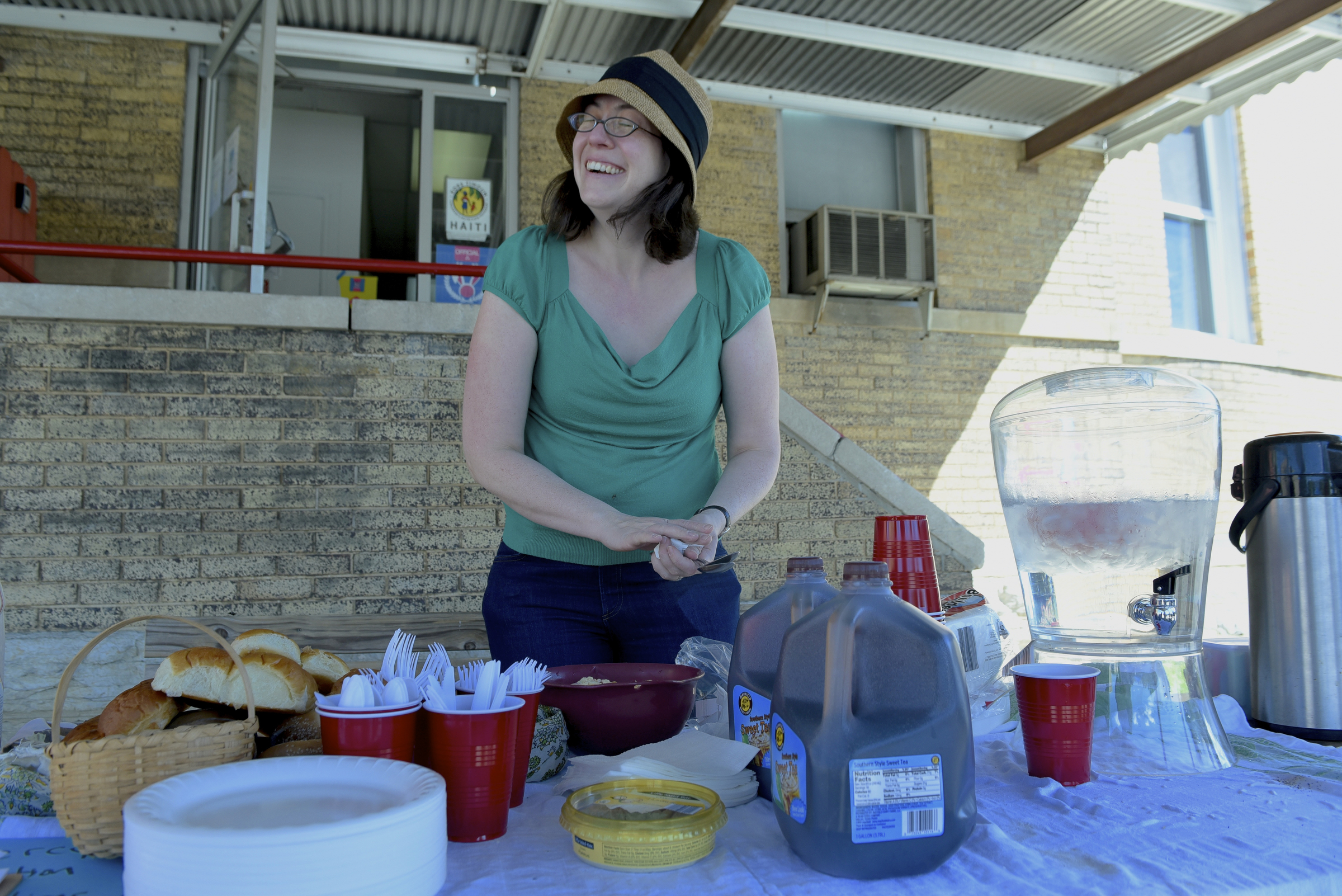 Tara Rose readies lunch in the parking lot after a worship service at the Mercy Junction Justice and Peace Center at St. Andrews in the Highland Park community on Sunday, Sept. 13, 2015, in Chattanooga, Tenn.