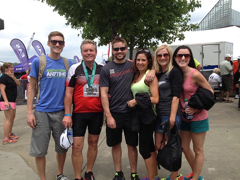 Steve Bean, second from left, with his family, including Cameron, left, after completing the half Ironman in May.