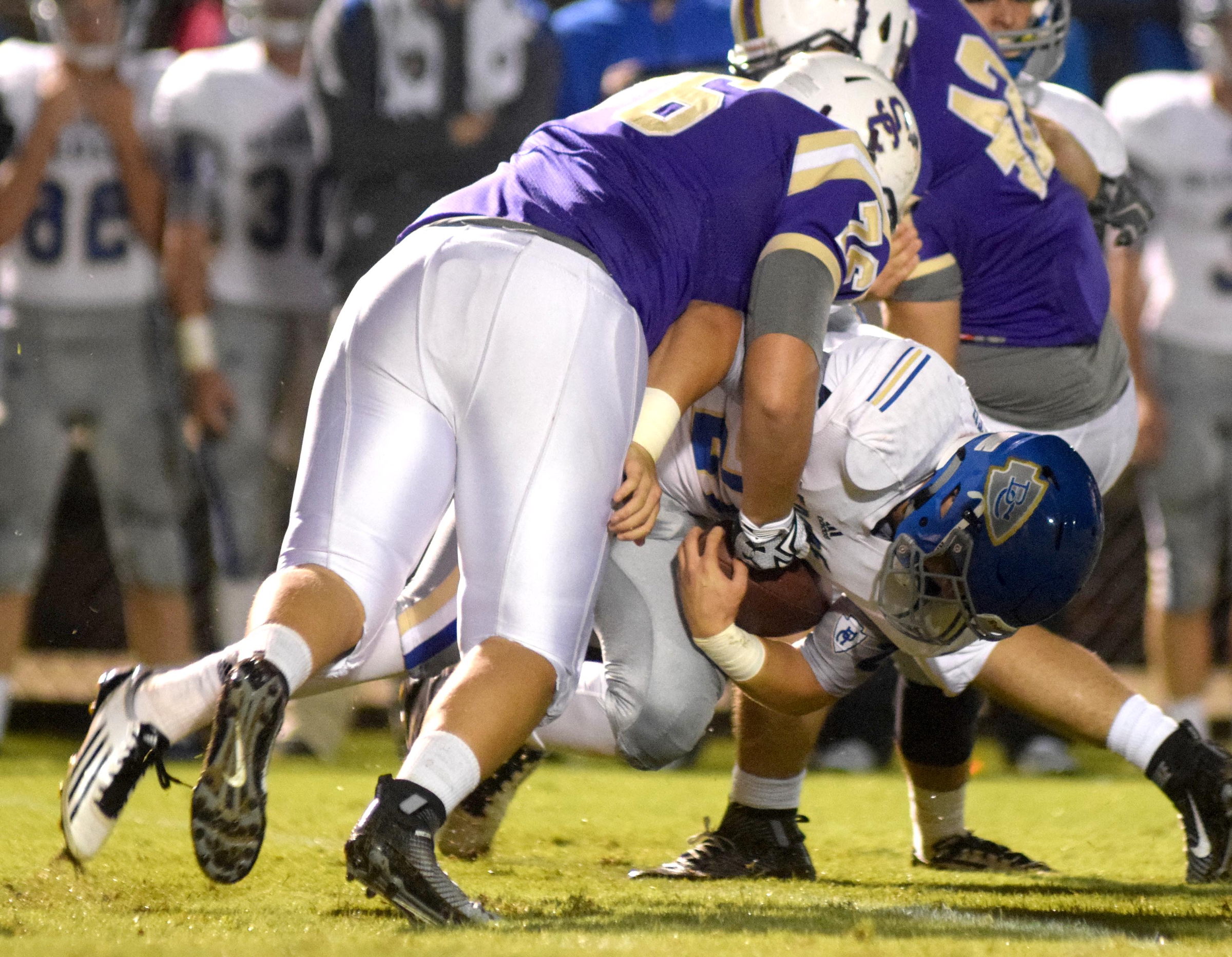 Sequatchie County's Jospeh Coulson (76) tackles Bledsoe County's Caleb Smith (21). The Bledsoe County Warriors visited the Sequatchie County Indians in TSSAA football action Saturday September 25, 2015.