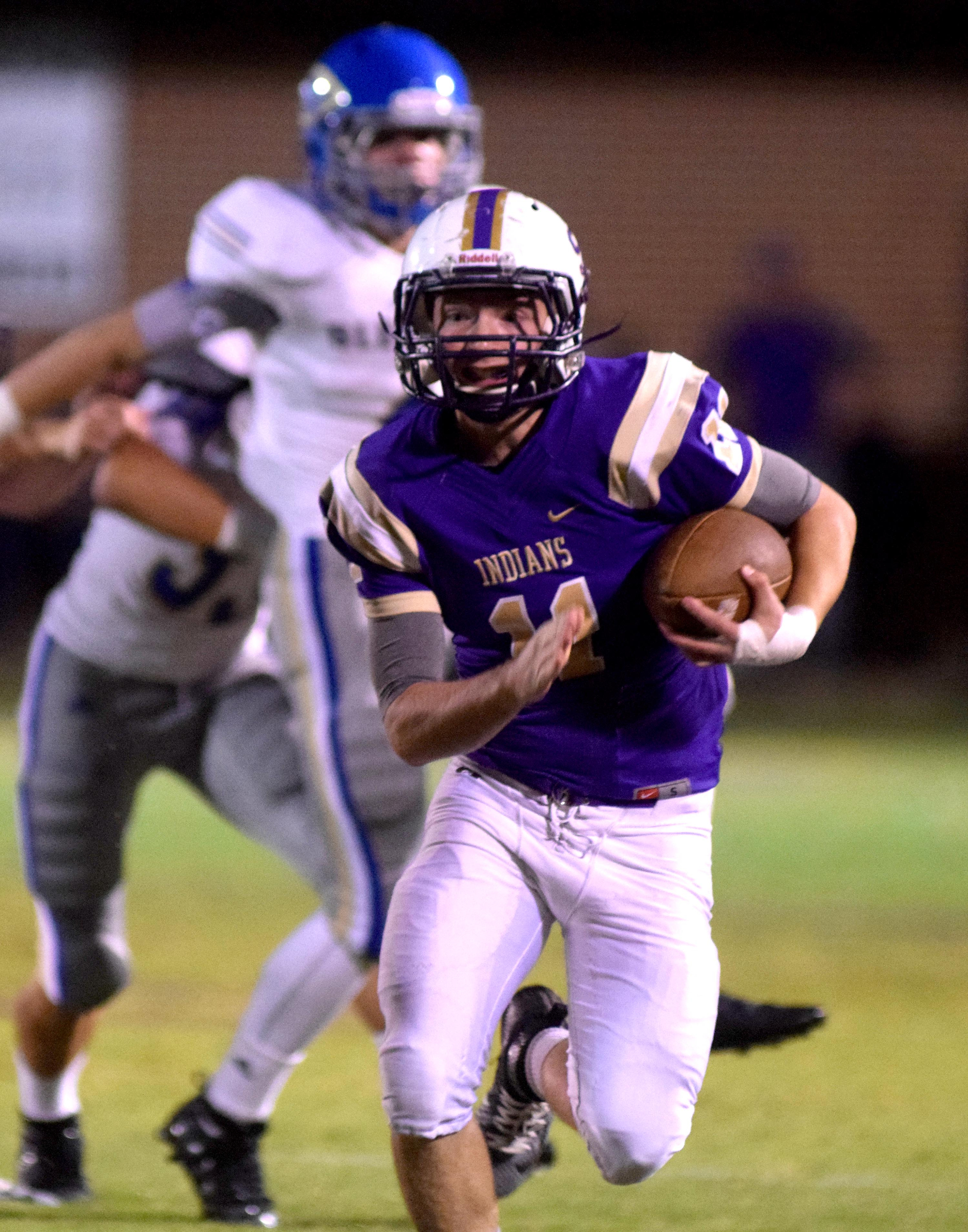 Staff Photo by Robin Rudd Sequatchie's Troy Sanders (11) returns a Bledsoe punt. The Bledsoe County Warriors visited the Sequatchie County Indians in TSSAA football action Saturday September 25, 2015.