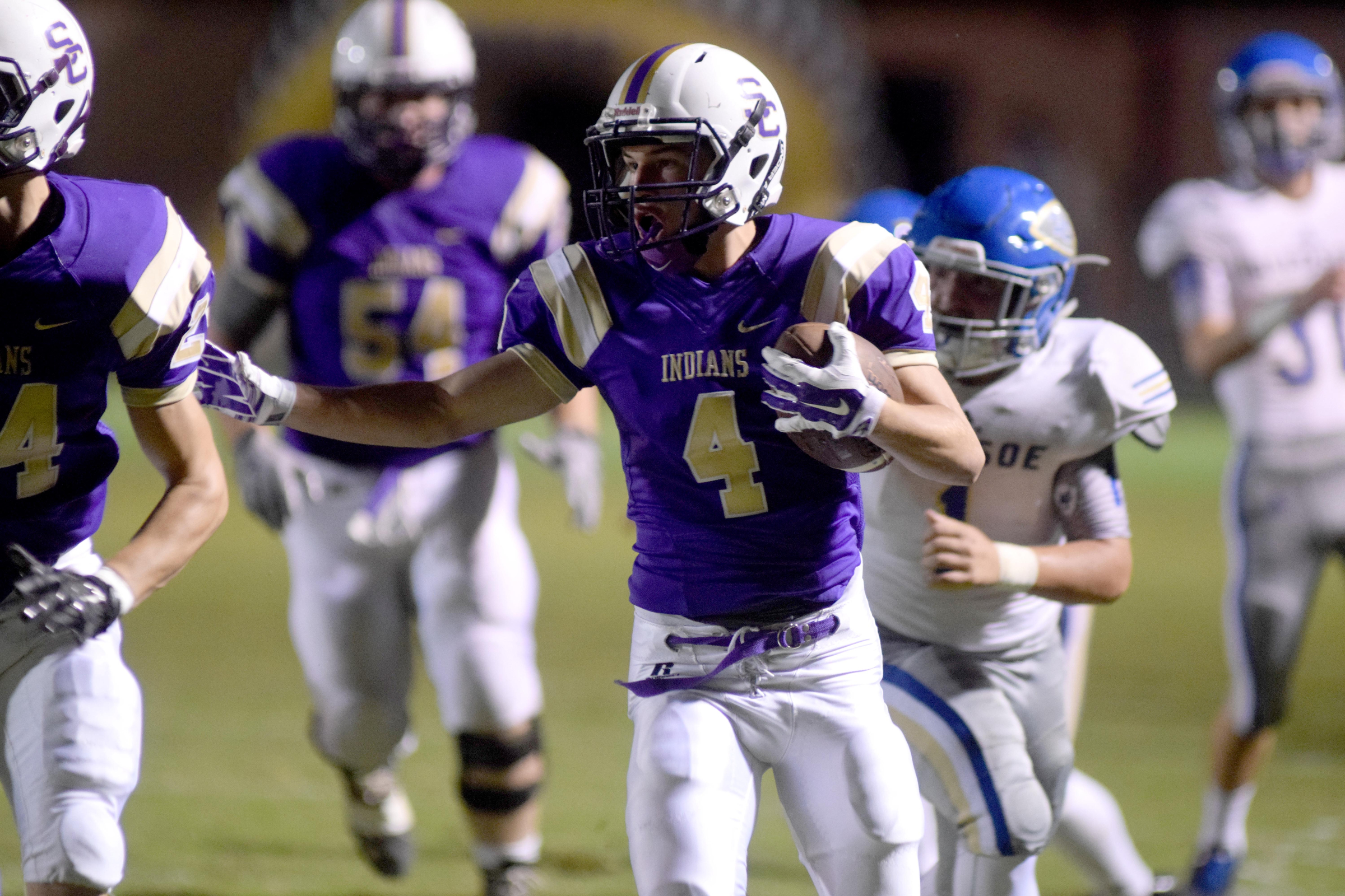 Sequatchie County's Alec Hudson (4) follows his blocking down the sidelines for a Indian touchdown. The Bledsoe County Warriors visited the Sequatchie County Indians in TSSAA football action Saturday September 25, 2015.