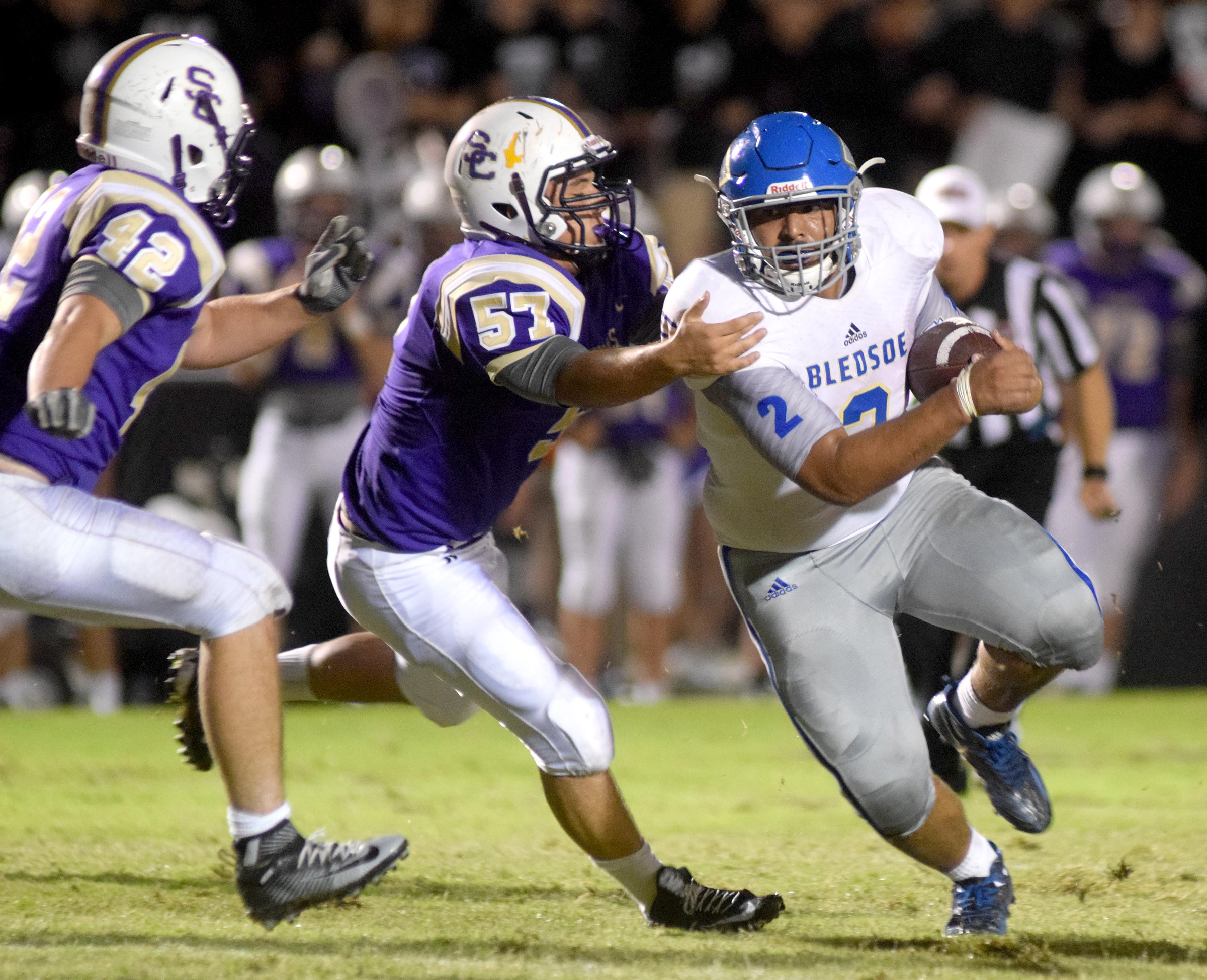 Sequqtchie County's Tanner Rheal (57) and Josh Bailey (42) move in to stop Bledsoe's Tavien Dodd (2) after a small gain. The Bledsoe County Warriors visited the Sequatchie County Indians in TSSAA football action Saturday September 25, 2015.