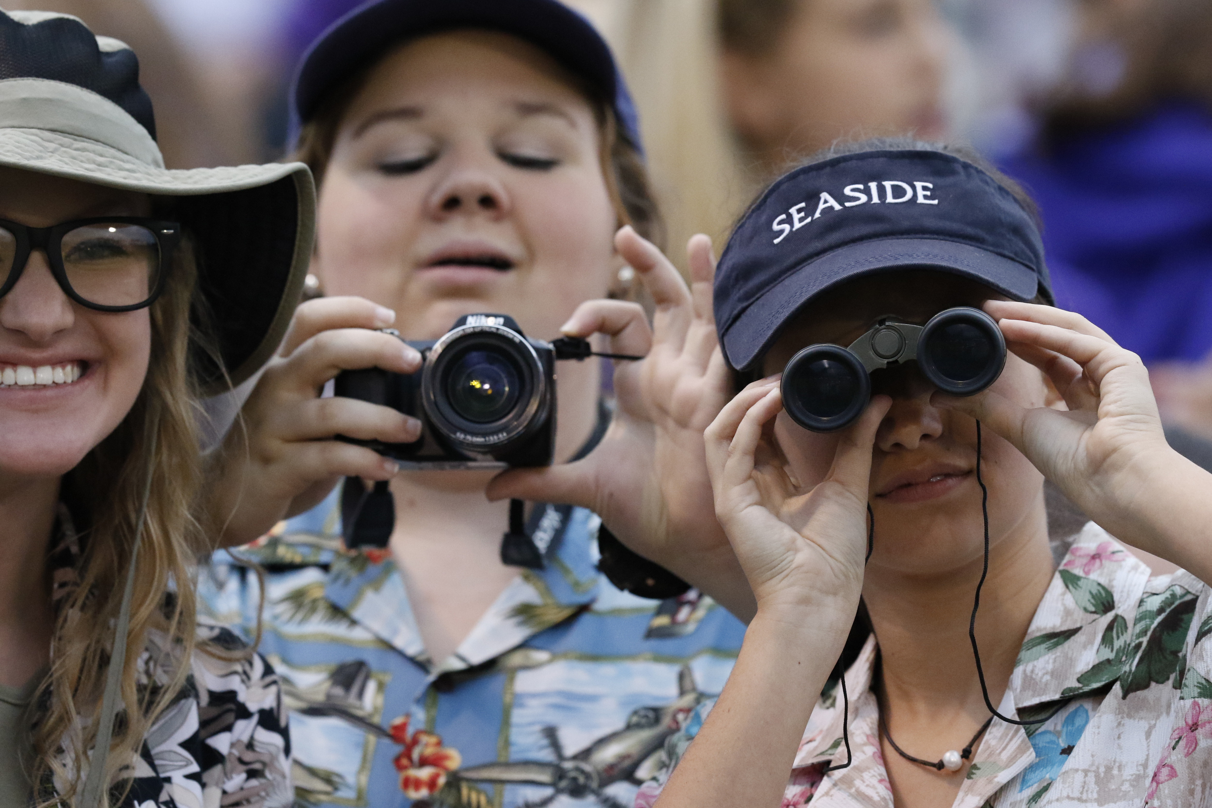 Staff Photo by Dan Henry / The Chattanooga Times Free Press- 9/25/15. Marion County junior classmen Chloe Campbell, Pressley Dawson (cq) and Kolbe Griffith, from left, dress up as tourists to cheer their team as they play Boyd-Buchanan at the Buccaneers home field Friday, September 25, 2015.