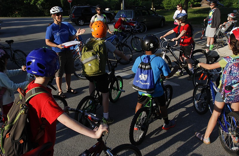 Terri Chapin, program coordinator with Outdoor Chattanooga, prepares CSAS students for the start of National Bike to School Day riding from the Chattanooga Riverpark to Chattanooga School for the Arts and Sciences in this 2014 file photo.