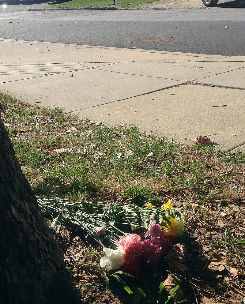 
              Flowers lie near the scene of where Delaware police officers fatally shot an armed man Wednesday, Sept. 23, 2015, in wheelchair after responding to a call that he had a self-inflicted gunshot wound, is seen Thursday, Sept. 24, 2015, in Wilmington, Del. Authorities say a shooting occurred and the man died at the scene.(AP Photo/Randall Chase)
            