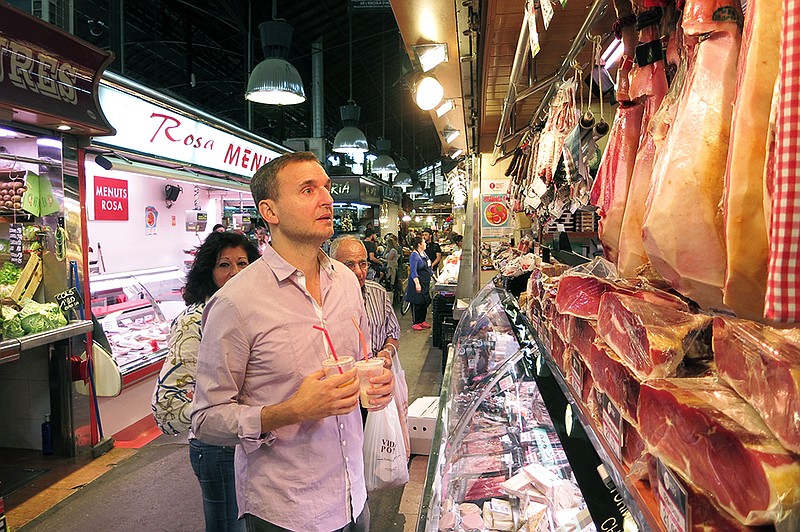 
              This photo provided by courtesy of WGBH shows, Phil Rosenthal, in a scene from the food series, "I'll Have What Phil's Having," in Barcelona. The show debuts Sept. 28, 2015, on PBS. (WGBH via AP)
            