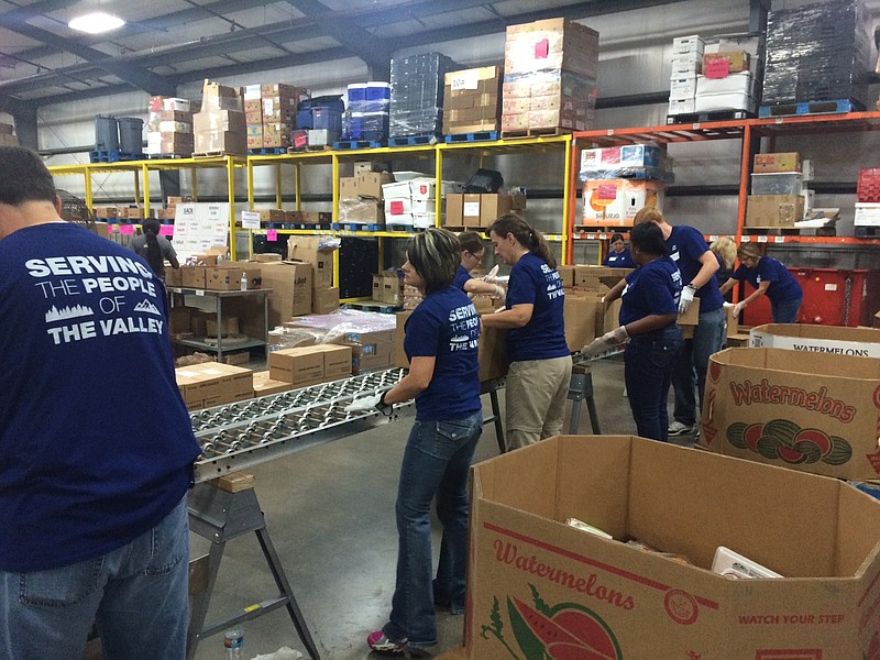 Federal employees volunteer at a community organization in Sept. 2015 during the Greater Chattanooga Area Combined Federal Campaign 23rd Annual Day of Caring.