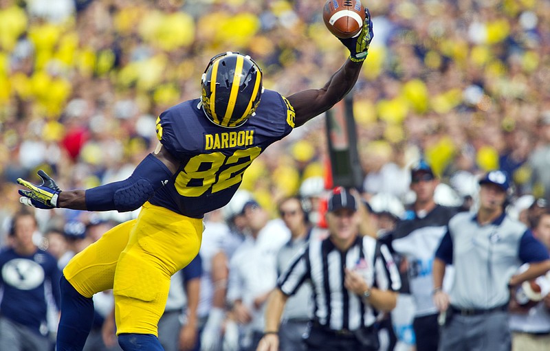 
              Michigan wide receiver Amara Darboh (82) makes a one-handed catch in the first quarter of an NCAA college football game against BYU in Ann Arbor, Mich., Saturday, Sept. 26, 2015. (AP Photo/Tony Ding)
            