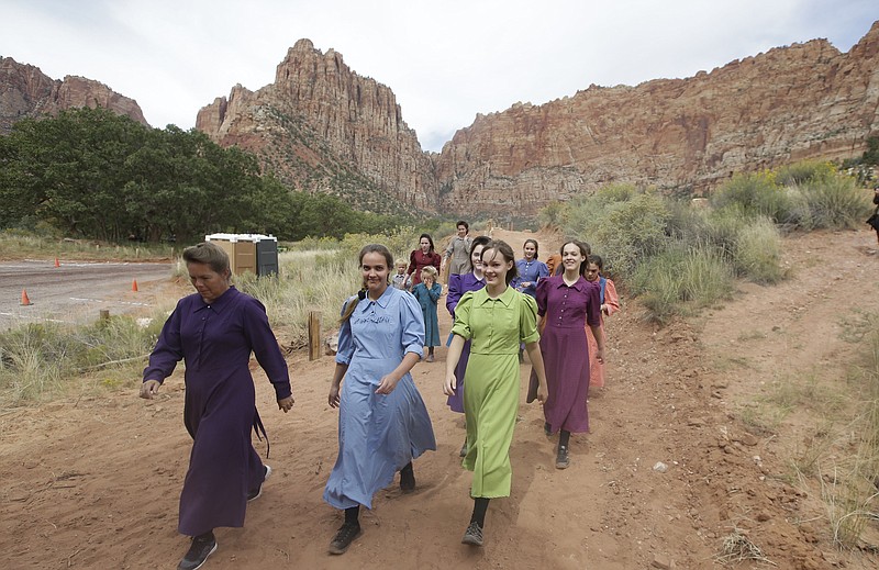
              Community members attend a memorial service Saturday, Sept. 26, 2015, in Hildale, Utah, hosted by two polygamous towns on the Utah-Arizona border for 12 women and children swept away in a deadly flash flood nearly two weeks ago. (AP Photo/Rick Bowmer)
            