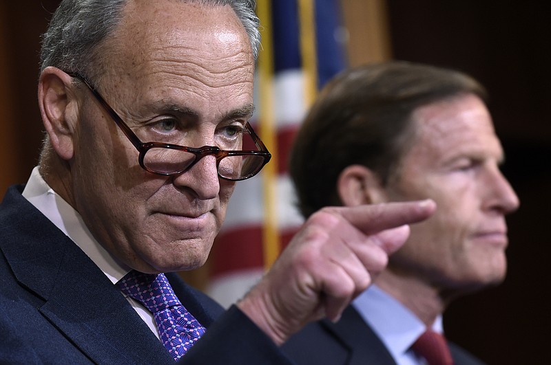 
              File-This May 7, 2015, file photo shows Sen. Charles Schumer, D-N.Y., left, accompanied by Sen. Richard Blumenthal, D-Conn., calling on a reporter during a news conference on Capitol Hill in Washington.  Schumer, says in a statement released early Sunday, Sept. 27, 2015, that the Federal Trade Commission, which is reviewing its regulations on eyeglasses, should require eyecare providers to give complete eyeglass prescription information to consumers. Schumer says consumers could then use this information to shop around for the best deals on glasses. Schumer is also calling for the FTC to require eyecare providers to verify information about a prescription to third-party sellers in a reasonable amount of time.  (AP Photo/Susan Walsh, File)
            