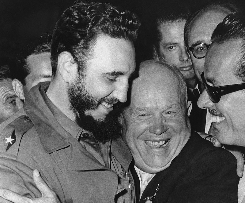 In a Sept. 20, 1960 file photo, Cuban leader Fidel Castro, left, and Soviet leader Nikita Khrushchev hug at the United Nations.  (AP Photo/Marty Lederhandler, File)
            