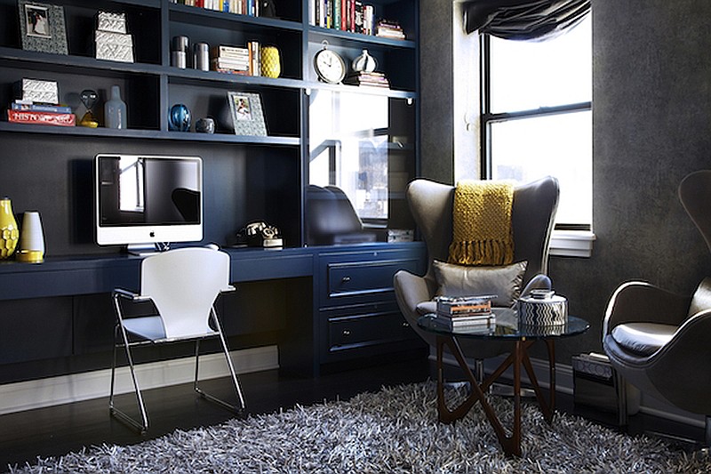 A home office space created by Danielle Colding Design combines an ample workspace and plenty of storage, all in one, custom built-in wall unit. By extending the unit to the ceiling, Colding created plenty of additional room for displaying decorative pieces and mementos. (James Ransom/Danielle Colding Design, Inc. via AP)