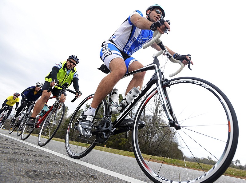 In this in this Saturday Feb. 21, 2015, photo, bicyclists ride along U.S. Highway 80 as they participate in the Selma 50 Bicycle Ride from Selma to Montgomery, Ala. 