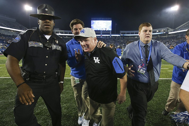 Kentucky football coach Mark Stoops, shown here after Saturday night's 21-13 win over No. 25 Missouri, is 8-8 the past two seasons after a 2-10 debut year.