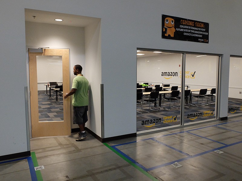 Andrew Phinisee enters his AutoCAD class Tuesday afternoon inside the Amazon Fulfillment Center's Career Choice classroom. Amazon employees clock out from their job and go straight to class, never having to leave the building.