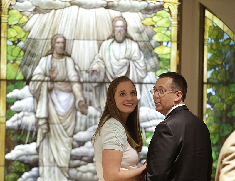 
              Laurel and Hyrum Ence tour the Mormon Church History Museum, Tuesday, Sept. 29, 2015, in Salt Lake City. The Mormon church’s renovated history museum set to reopen this week features a small and surprising display about an uncomfortable part of the faith’s history that for generations has been glossed over: polygamy. (AP Photo/Rick Bowmer)
            