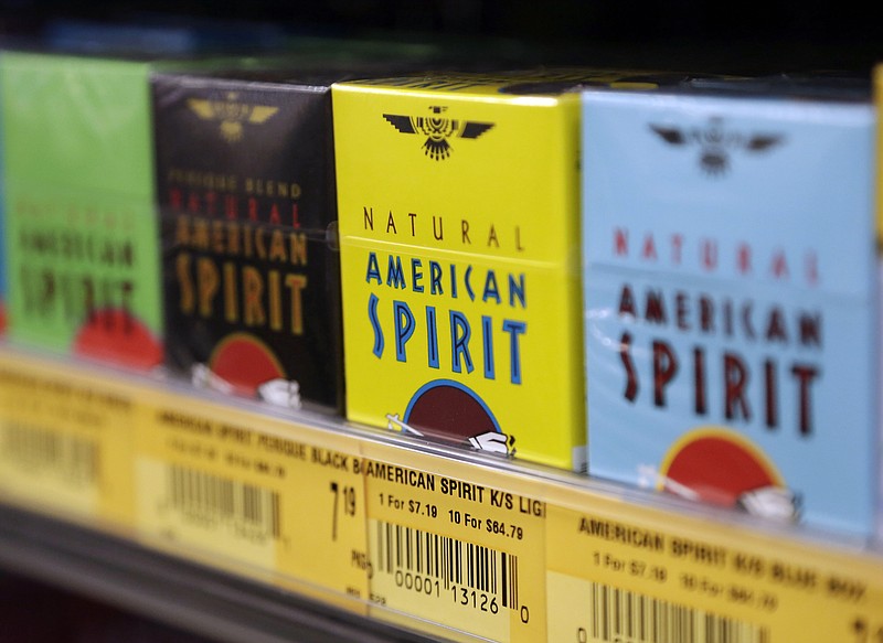 
              FILE - In this July 15, 2014, file photo, Natural American Spirit cigarettes are on display for sale, in Doral, Fla. Japan Tobacco is buying the non-U.S. assets of Reynolds American's Natural American Spirit for about $5 billion in cash, the companies announced, Tuesday, Sept. 29, 2015. The deal doesn't include rights to the Natural American Spirit brand name and associated trademarks in the U.S., U.S. duty-free locations, U.S. territories or in U.S. military outlets, all which will be kept by Reynolds American subsidiary Santa Fe Natural Tobacco Co. (AP Photo/Lynne Sladky, File)
            