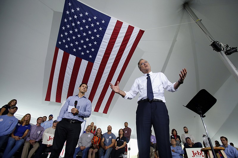 
              Republican presidential candidate, former Florida Gov. Jeb Bush, right, outlines his energy policy during a visit to Rice Energy, an oil and gas company based in Canonsburg, Pa., Tuesday, Sept. 29, 2015.  (AP Photo/Gene J. Puskar)
            