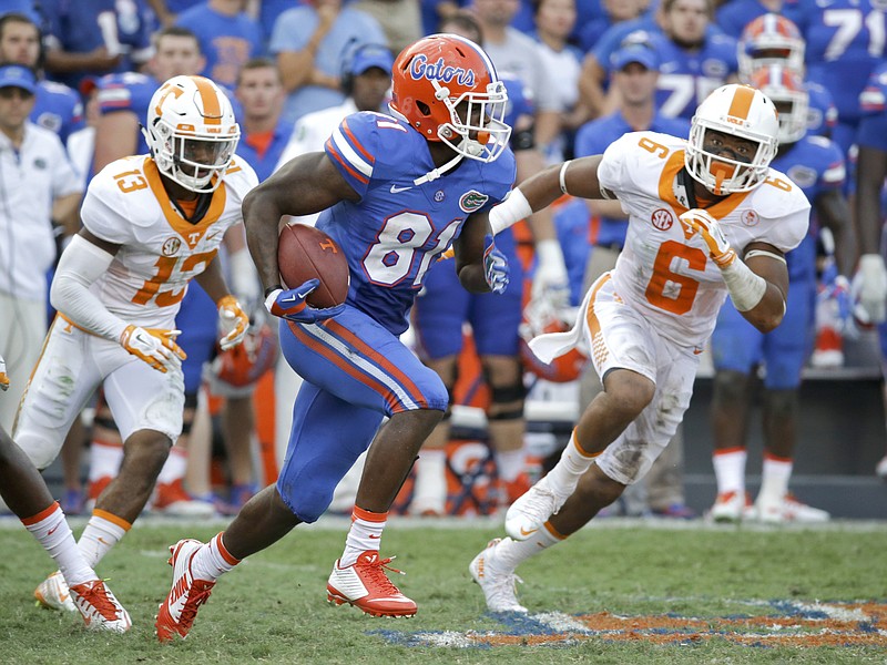 Florida wide receiver Antonio Callaway runs past Tennessee defensive backs Malik Foreman, left, and Todd Kelly Jr. during the second half of Saturday's game in Gainesville, Fla. The Volunteers' struggles to stop teams on fourth down proved costly in both of their losses in September, to Oklahoma and the Gators.