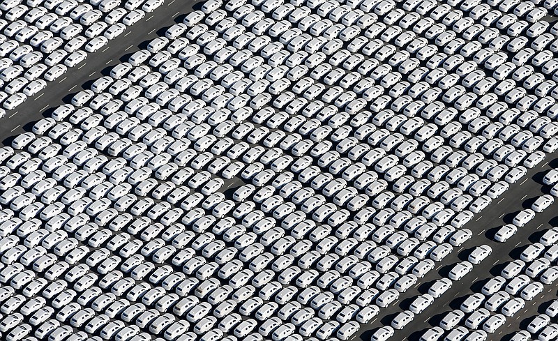 
              New cars of the German car manufacturer Volkswagen are ready to be shipped at the Volkswagen factory in Emden, Germany, Sept. 30, 2015. (Ingo Wagner, dpa via AP)
            