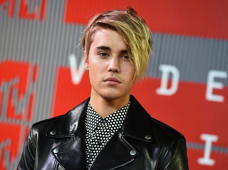 
              FILE - In this Aug. 30, 2015 file photo, Justin Bieber arrives at the MTV Video Music Awards in Los Angeles. The 2nd District Court of Appeal in Los Angeles ruled Wednesday, Sept. 30, 2015, that a 2010 law enacted to curb reckless driving by the paparazzi does not violate the First Amendment and a case against a photographer charged with recklessly chasing Bieber on a Los Angeles freeway in 2012 should be reinstated. (Photo by Jordan Strauss/Invision/AP, File)
            