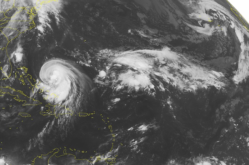 
              This NOAA satellite image taken Wednesday, September 30, 2015 at 12:45 AM EDT shows Tropical Storm Joaquin barreling into the Bahama Islands with maximum sustained winds of seventy miles per hour. This tropical system is expected to quickly become a hurricane as it continues to progress further towards the eastern seaboard of the United States. Heavy to moderate rain bands and gusty winds are currently covering the Turks and Caicos Islands.  (Weather Underground via AP)
            