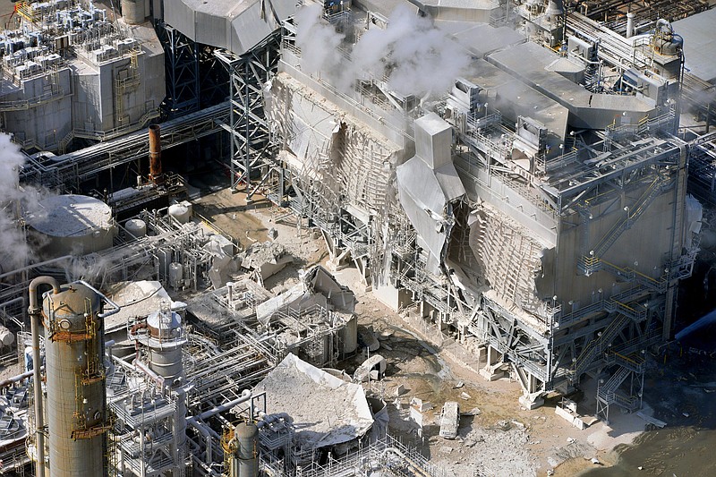 
              FILE - This Feb. 18, 2015 file photo shows a structure damaged after an explosion in a processing facility at the Exxon Mobil refinery in Torrance, Calif. PBF Energy Inc. announced Wednesday, Sept. 30, 2015 that Exxon Mobil is selling its troubled Southern California refinery for $537 million to a New Jersey energy company. Torrance plant is expected to close next year.The refinery has been shut down since an explosion in February injured four contractors and caused heavy damage. (Brad Graverson/Daily Breeze via AP, File)
            