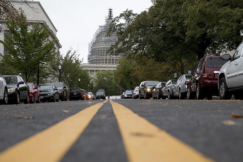 The Capitol Dome, covered with scaffolding is seen on Capitol Hill in Washington, Wednesday, Sept. 30, 2015.