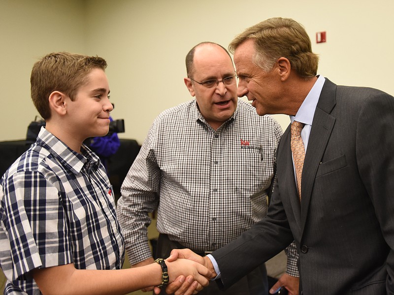 Gov. Bill Haslam meets Micah, left, and Andy Hodes on Thursday at the Jewish Federation of Greater Chattanooga.