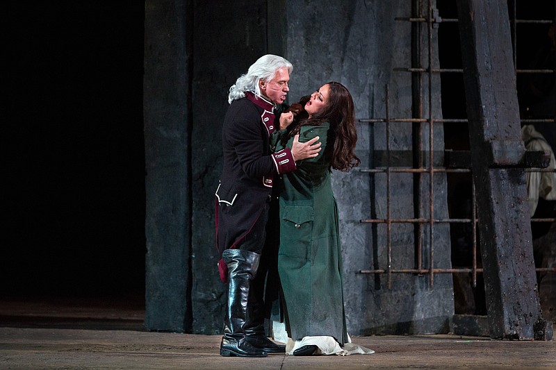 
              In this Sept. 16, 2015 photo released by the Metropolitan Opera, soprano Anna Netrebko, right, and baritone Dmitri Hvorostovsky perform in a scene from Verdi's "Il Trovatore" at the Metropolitan Opera in New York. The Metropolitan Opera is kicking off its 10th season of live HD broadcasts this Saturday with Verdi's “Il Trovatore." (Marty Sohl/Metropolitan Opera via AP)
            