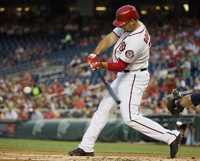 Washington Nationals' Clint Robinson hits a two-run single in hisl game against the Atlanta Braves at Nationals Park, Thursday, Sept. 3, 2015, in Washington.