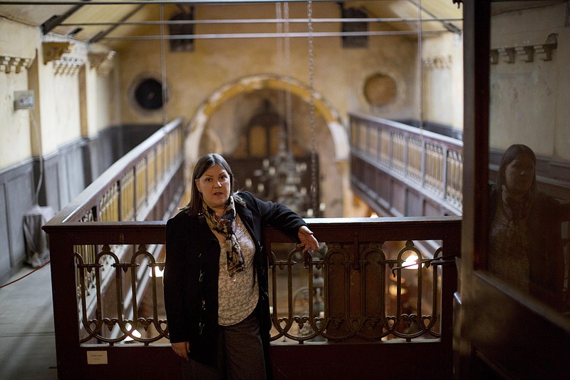 
              In this Sept. 15, 2015 photo, Susie Symes, Chair of Trustees of Britain's museum of immigration and diversity poses for a photograph at the museum in a Georgian house built in 1719 on Princelet Street in Spitalfields, London. Europe is a tapestry of migrants assimilated into the fabric of the region over centuries, a process which has broadly accepted outsiders of every religion and creed into the European family, a process which will continue with migrants as would-be Europeans arriving now, says Columbia University sociologist Saskia Sassen. (AP Photo/Matt Dunham) *No Sales - No Archives*
            