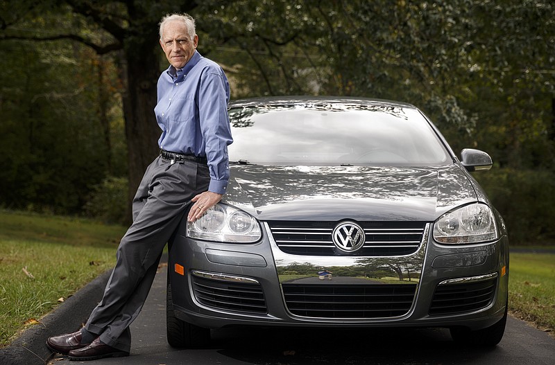 Bill Sonnenburg stands with his 2009 Volkswagen Jetta TDI on Wednesday, Sept. 30, 2015, in Signal Mountain, Tenn. Sonnenburg is a named plaintiff in a local class-action lawsuit filed against the car manufacturer following news that the company programmed its diesel-engine vehicles to cheat on emissions tests.