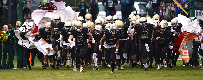 Notre Dame players run onto the field before the game against East Ridge Friday, October 2, 2015 at Notre Dame High School.