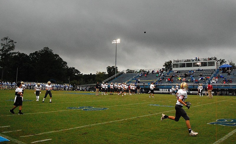 Christian Heritage warms up under a theartening sky.  The Christian Heritage Lions visited the Trion Bulldogs in GHSA football action Friday October 2, 2015.