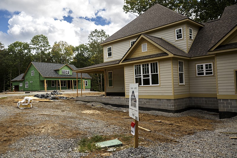 Houses being constructed in the under-development Wild Ridge subdivision are seen on Wednesday, Sept. 30, 2015, in Signal Mountain, Tenn. Proposed zoning changes to reduce the minimum size of some existing lots in the town have some residents worried about overdevelopment.