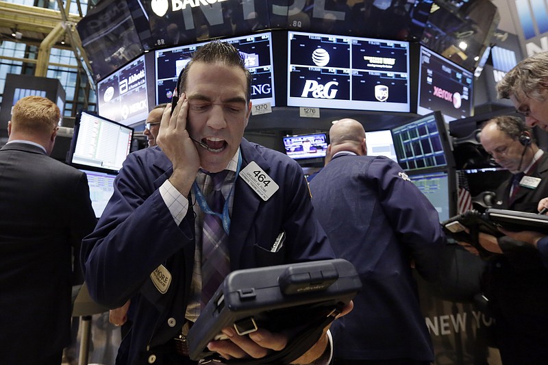 
              Trader Gregory Rowe works on the floor of the New York Stock Exchange, Friday, Oct. 2, 2015. A weak report on the U.S. jobs market is sending the stock market and the dollar sharply lower in early trading. (AP Photo/Richard Drew)
            