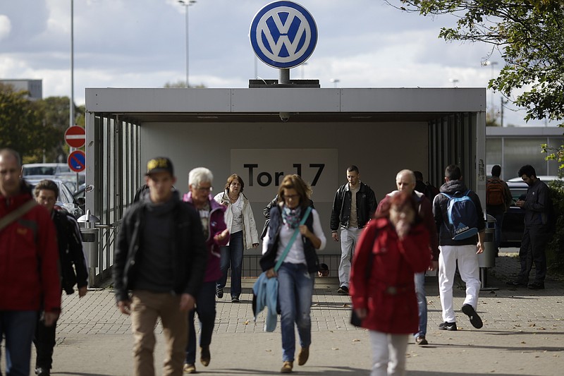 
              FILE - In this Sept. 29, 2015, file photo, people leave Volkswagen car factory in Wolfsburg, Germany. More than a decade ago, the U.S. Environmental Protection Agency helped develop a technology that ultimately allowed an independent laboratory to catch Volkswagen’s elaborate cheating on car emissions tests. But EPA did not apply that technology on its own tests of diesel passenger cars and instead focused on trucks, thus missing its best chance to foil the German carmaker’s deception as early as 2007. (AP Photo/Markus Schreiber, File)
            