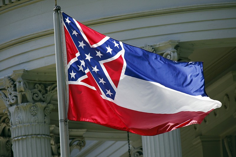 
              In this photo taken June 23, 2015, the Mississippi state flag is unfurled against the front of the Governor's Mansion in Jackson, Miss.  A new proposal seeks a statewide election on removing the Confederate battle emblem from the Mississippi flag. But it could be years before the issue gets on the ballot, and there's no guarantee voters would accept it.(AP Photo/Rogelio V. Solis)
            