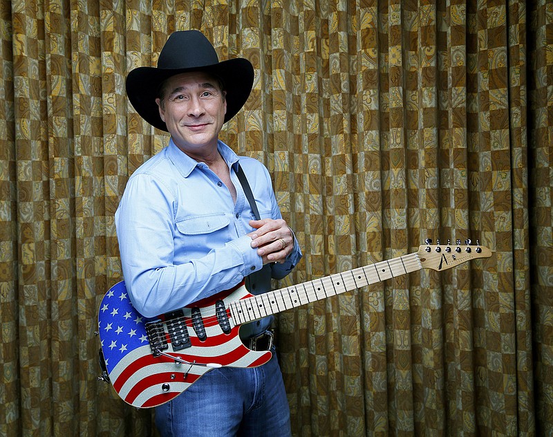 
              In this Sept. 22, 2015 photo, musician Clint Black poses for a photo at his home in Forest Hills, Tenn. The singer-songwriter with the black hat and the traditional country sound was one of the best-selling artists of the ‘90s, selling more than 20 million albums worldwide. After years of being courted by major labels, this year he signed a deal with Thirty Tigers, an independent label in Nashville, to put out “On Purpose,” which released on Sept. 25. (Photo by Donn Jones/Invision/AP)
            